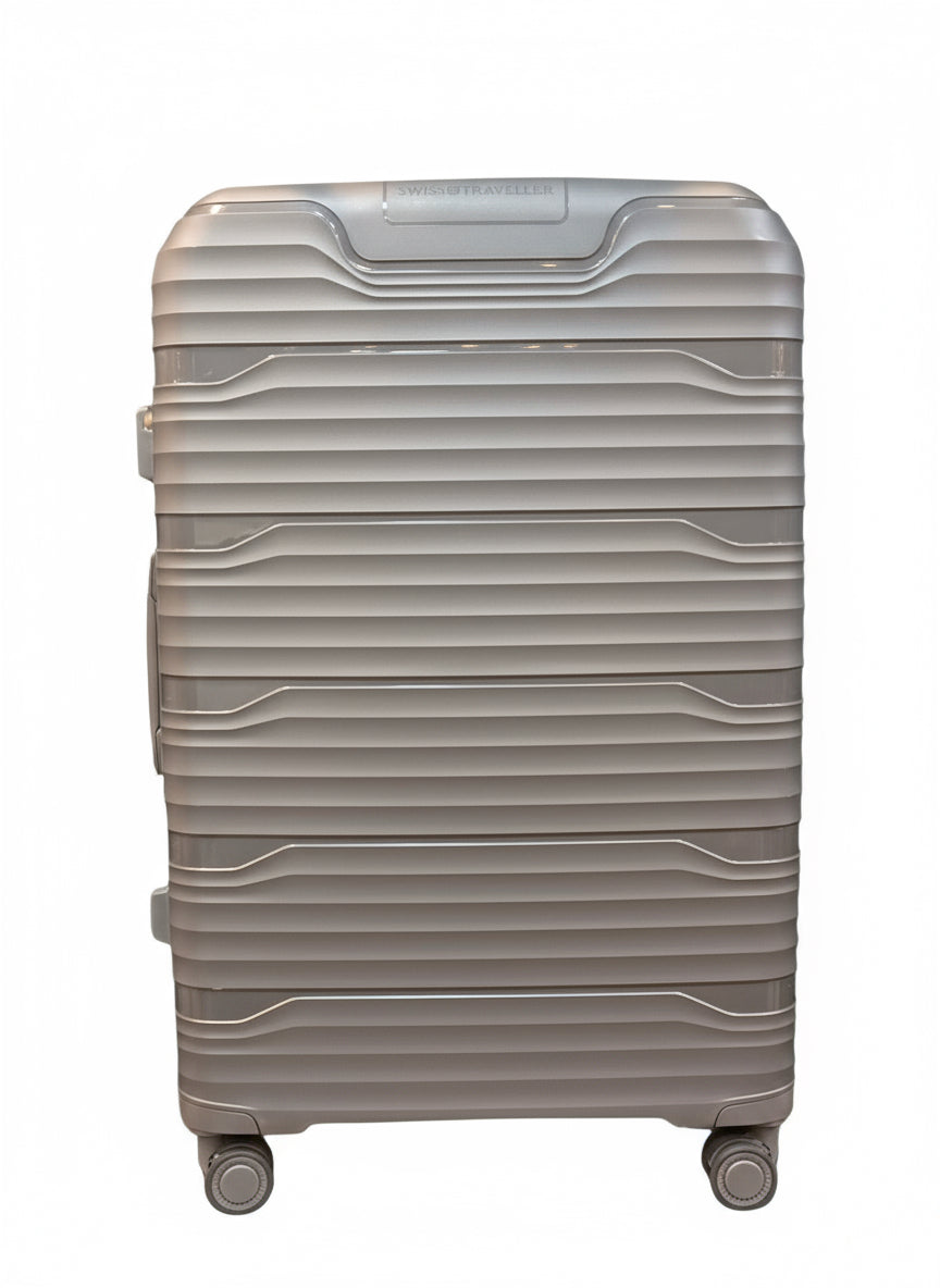 Beige suitcase with wheels on a tiled floor in an indoor setting